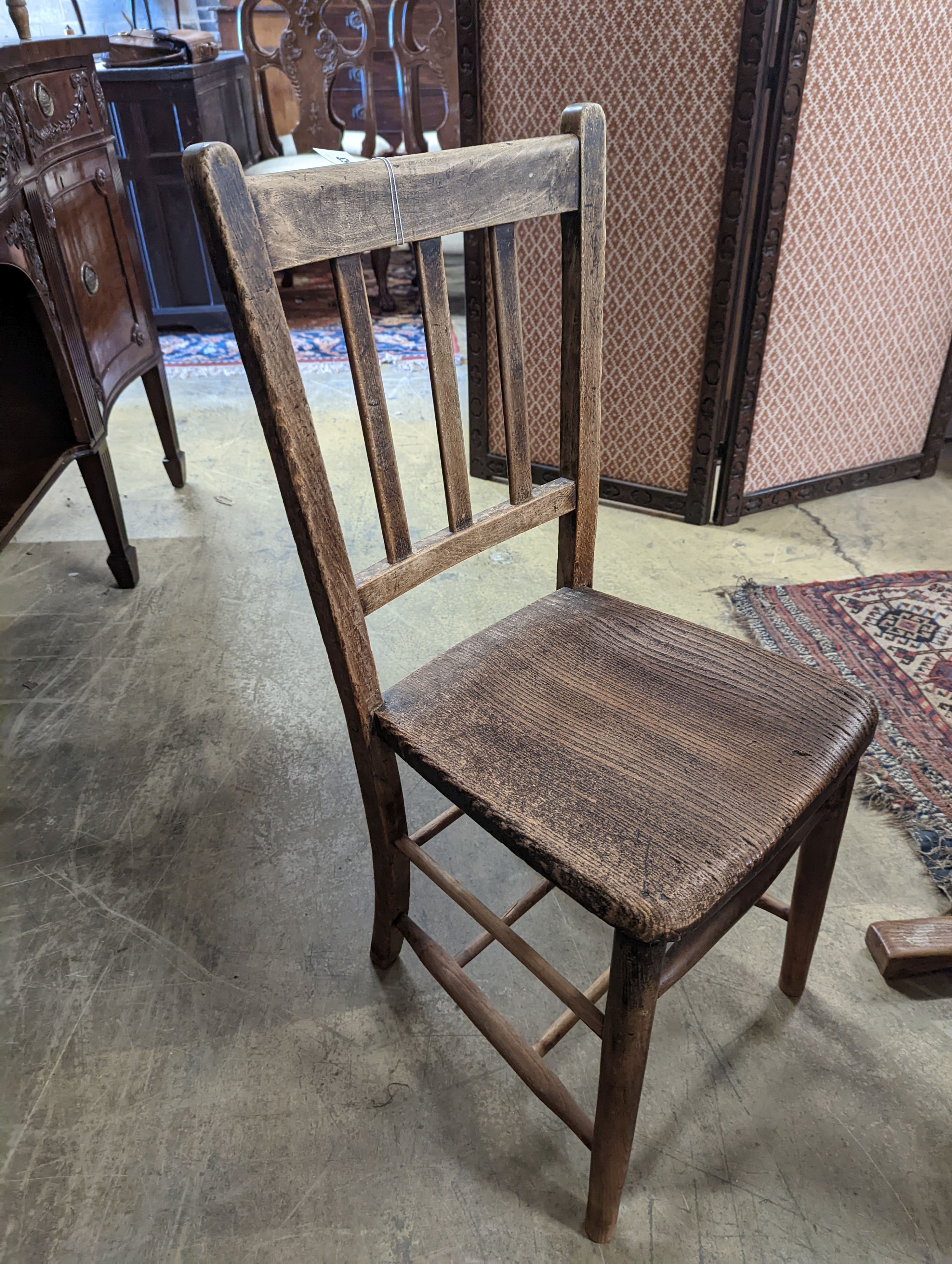 A vintage oak student's desk, width 57cm, depth 46cm, height 71cm with an elm and beech chair